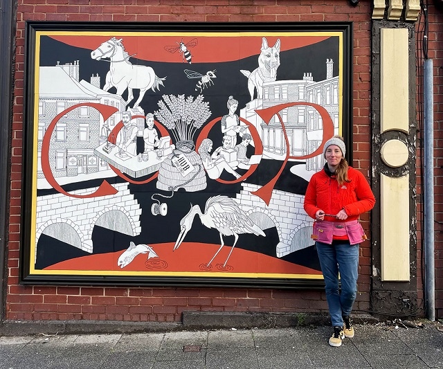 Doodlher with the Co-op mural at the back of the former Butterworth's jewellers
