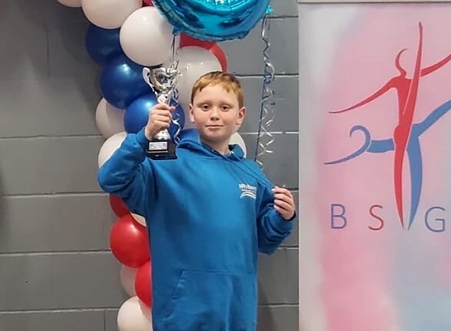 Jacob Hall celebrates his podium place in the British School’s Trampoline Championships
