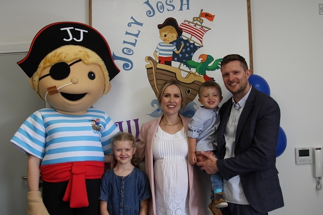 Jolly Josh opening - Carole and James Kelly with their children Oliver and Sophie, and the Jolly Josh mascot