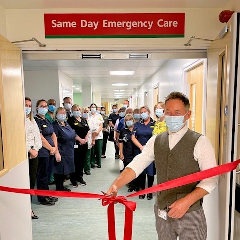 Steve Taylor, Chief Officer at Rochdale Care Organisation, cutting the red ribbon
