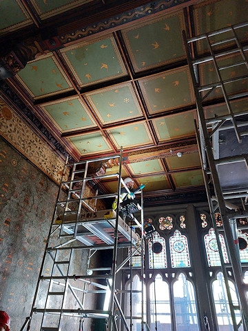 Working on cleaning the tiles on the scaffold at Rochdale Town Hall