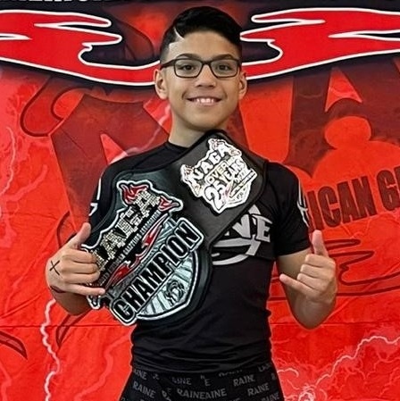 Andrew Perez with his champion belt