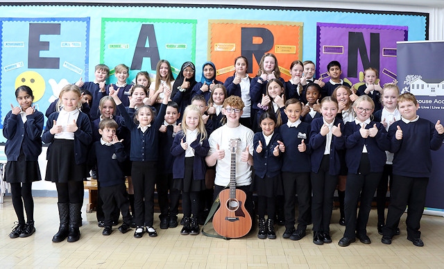 Will Edgar performed music to pupils at Moorhouse Academy