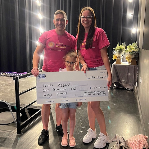 Neil, Alex with daughter and dance star Annabelle Taylor with a cheque for £1,500