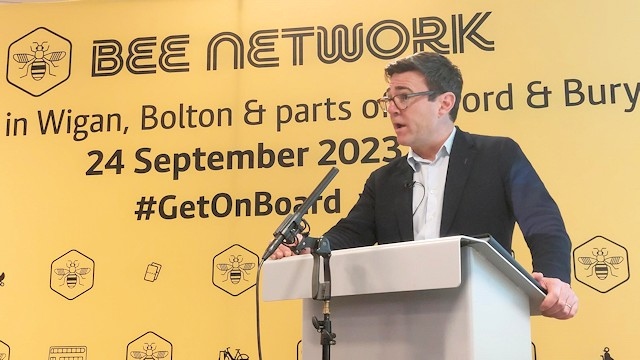 Greater Manchester mayor Andy Burnham with Bee Network branding