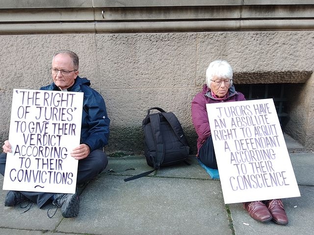 Reverend Mark Coleman and Pat Sanchez protest outside Minshull Street Crown Court in Manchester