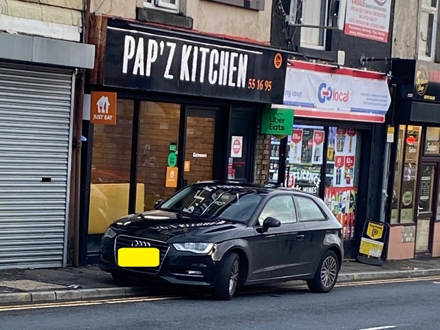 One of the vehicles parked on double yellow lines on Whitworth Road