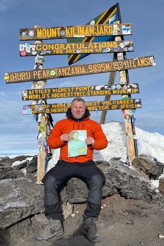 Stephen Shea at the summit of Kilimanjaro