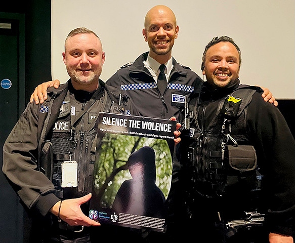Danny Inglis Chief Superintendent and police officers holding the Silence the Violence poster at the premiere
