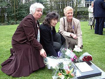 Vera Rigby, Sally Barma & Morgan Ogden lay flowers at the Memorial Stone