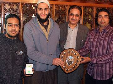 Wardleworh Cllrs Zulf and Farooq (Far right) present the Indoor cricket trophy to Bilal Legonds