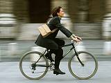 Woman on her way to work on a bicycle