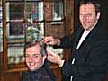 Greg Couzens cuts Chris Huhne's hair