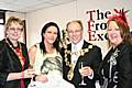 Dressed for success: Mayor of Rochdale, councillor Keith Swift, with Mayoress Sue Etchels, and Frock Exchange owner Linda Haworth