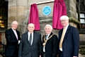 Rt. Hon Sir Menzies Campbell MP, Norman Smith, Mayor Godson and Paul Rowen stood below the blue plaque in memory of Sir Cyril Smith