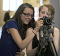 Catherine Lynch and Chloe Helm take photos at Mayor-Making ceremony