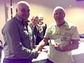 Graham Poole presenting cheques to Peter Schofield of Littleborough Historical Society