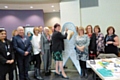Councillor Janet Emsley signing the White Ribbon pledge with council staff, councillors and partner agencies