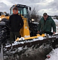 Farmers Elliot Eaton Greenwood and Stewart Greenwood ensuring the roads are clear