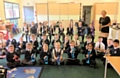 Wardle Academy staff with primary school children for music lessons