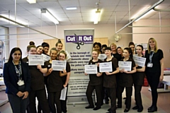 Jaria (left) and Wendy (right) from the council's domestic abuse team with students from Hopwood Hall College