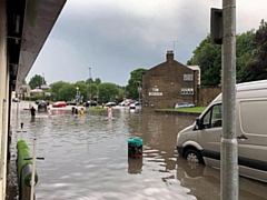 Flash flooding in Milnrow at the junction of Bridge Street, Dale Street and Kiln Street