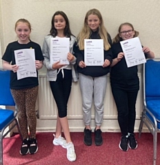 Four of Mandy Tiffany's students with their LAMDA certificates