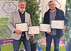 Phil Starr and Paul Ellison with four of the It's Your Neighbourhood awards for Norden in Bloom