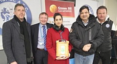 Directors Jamie Sarsfield and Tony Pockney (far left, left), as well as academy manager Tony Ellis (far right) were on hand to receive the defibrillator from Councillors Iram Faisal and Faisal Rana (centre, right)