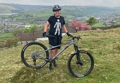 Whitworth Community High School student Owen Blackburn is cycling for charity in memory of his great-grandad Derek