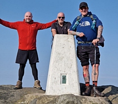 Darren Hibbert (far right) and the 'wanderers' will be climbing Scafell Pike