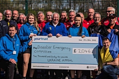 Players from the Walking Fotoball League and team members Your Trust Rochdale present the cheque to Michael Krylszyn, committee member of the Association of Ukrainians of Great Britain (Rochdale branch)
