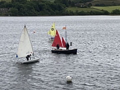 The access dinghies prepare to start a race