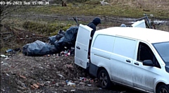 The men were caught dumping the bags from the back of the vehicle