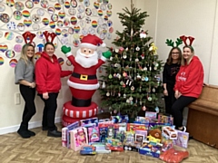 Staff at Newhey Community Primary School have collected toys and gifts for the Hits Radio Mission Christmas Cash for Kids donations this year