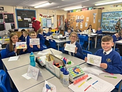 Children at Milnrow Parish Primary with their Christmas cards