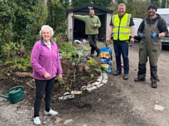 Dorothy Butterworth, and volunteers Andrew McConville, Paul Ellison and Ryan McCarthy, with her garden