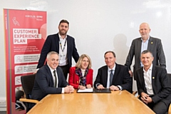 Representatives from TfGM and KAM meet to formally sign the contract extension
