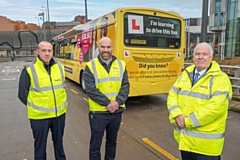 Paul Townley flanked by instructors Mark Thorpe (left) and Keith Fieldhouse test the training bus in Bee Network livery at Rochdale Interchange