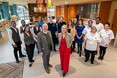 Councillor Peter Williams, cabinet member for housing and regeneration at Rochdale Borough Council and Ashleigh Thompson, general manager at the Hampton by Hilton Hotel (front of picture - left to right) with some of the Hampton by Hilton team 
