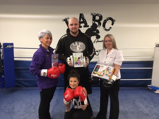 Mark Oldham, Head Coach at Boxing Club, with Jane Fletcher-Mills, Adherent Children's Worker with the Salvation Army and Danielle Warcaba and Adele Greenwood, members of LABC
