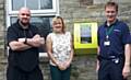 Julie Durrant & Mark Oldham from Littleborough Boxing and Fitness Club with Rod Cape of North West Ambulance Service with the new CPAD (Community Public Access Defibrillator)